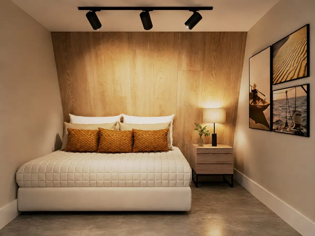 Quarto da suíte, materialidade em tons naturais